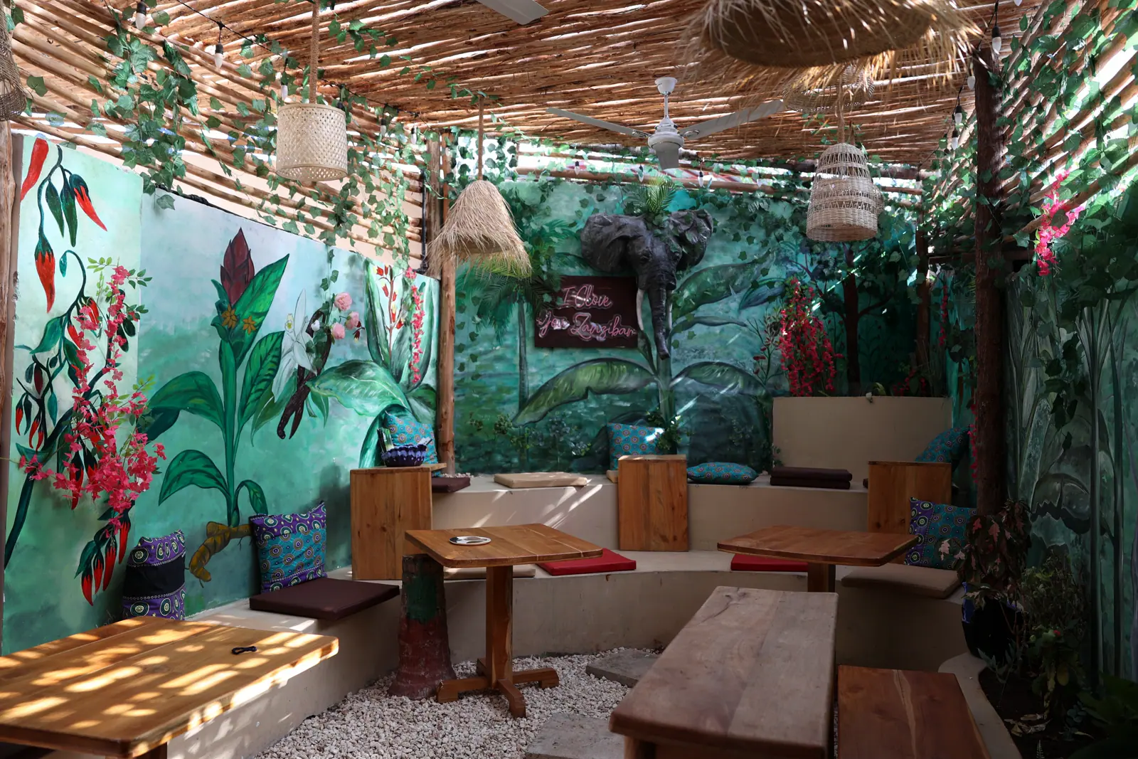 Painted interior of Assalam's Spice Route Museum beneath woven shade