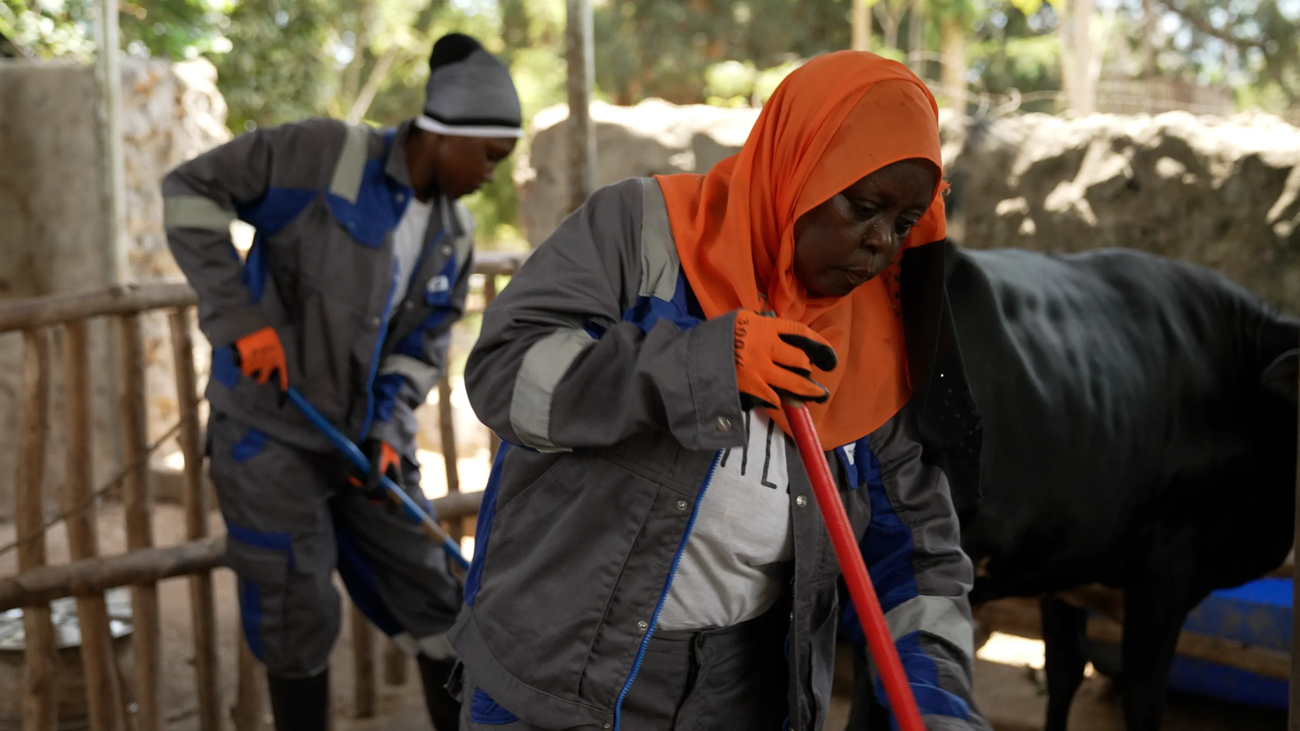 A woman taking part in a practical outdoor livelihood activity