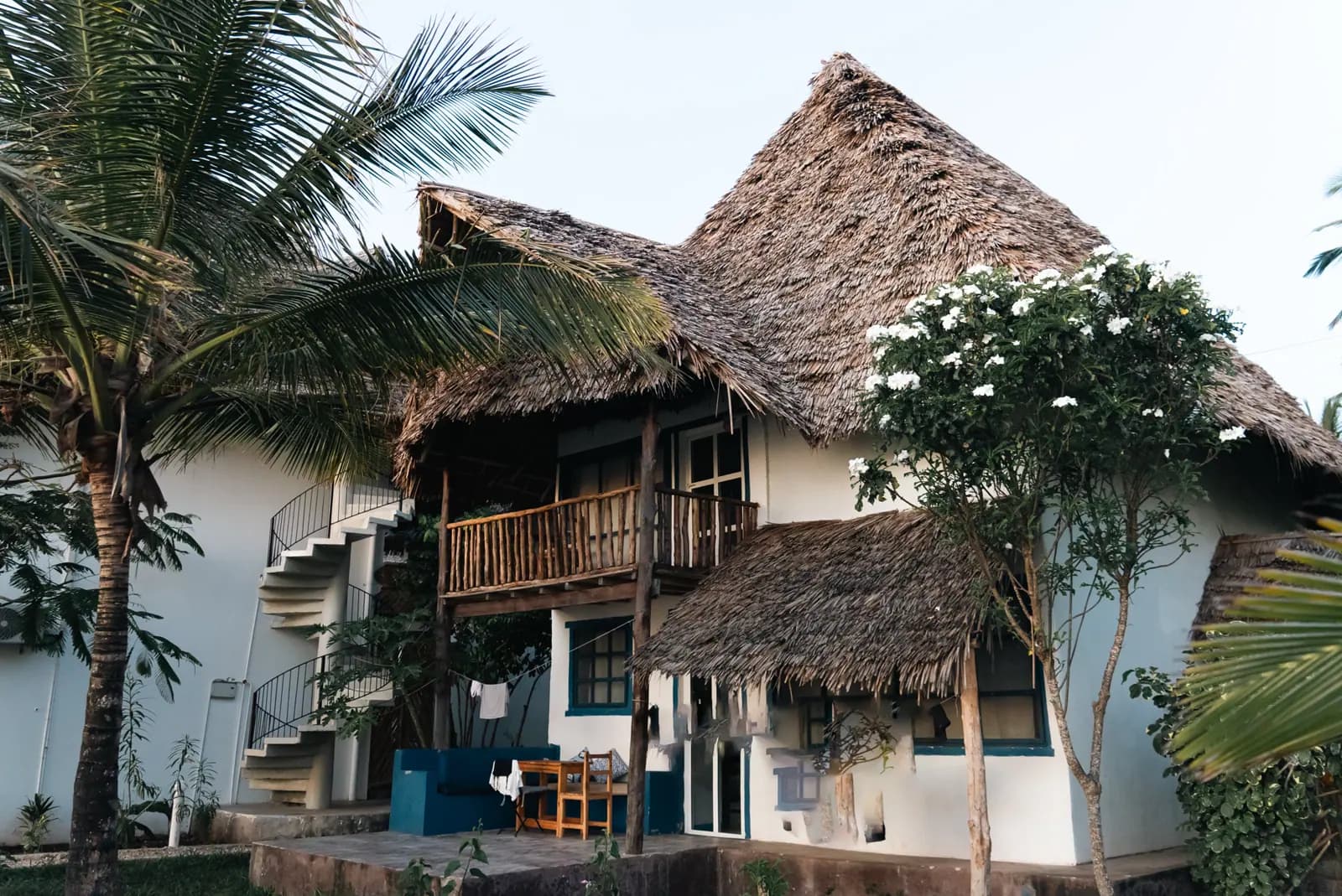 Multi-level building shaded by overlapping Makuti roofs